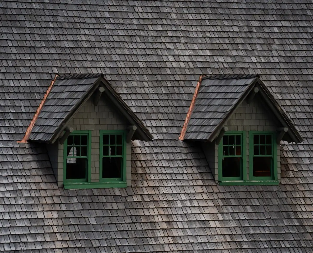 Dormers on a shingle roof in Valdosta, GA, where step flashing and kickout flashing carry water past the walls