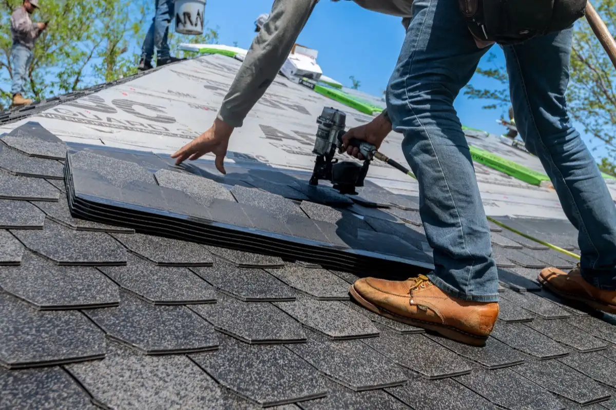 Inspecting an asphalt shingle slope after a hailstorm in Valdosta, GA